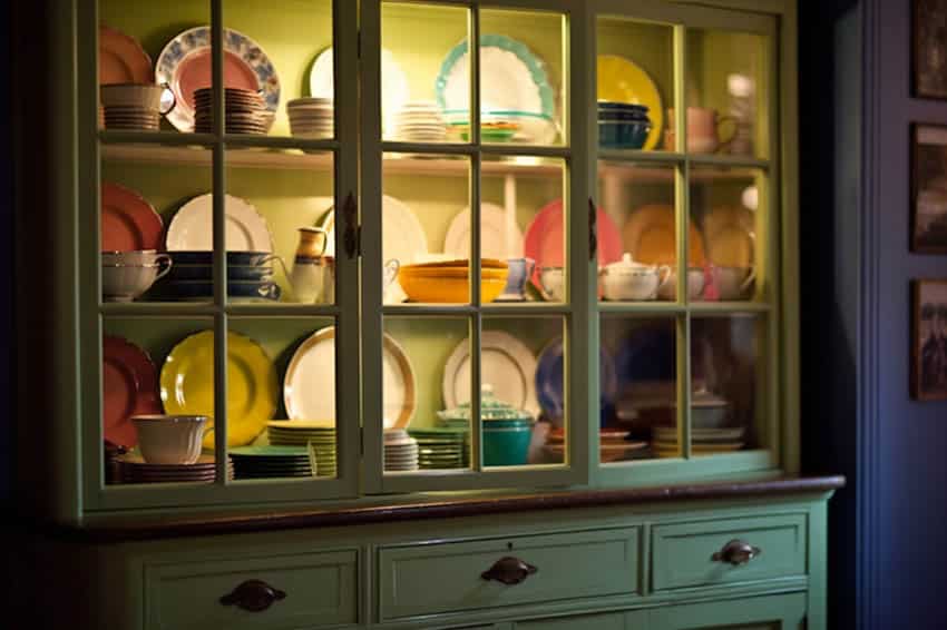 Colorful decor items in cabinet