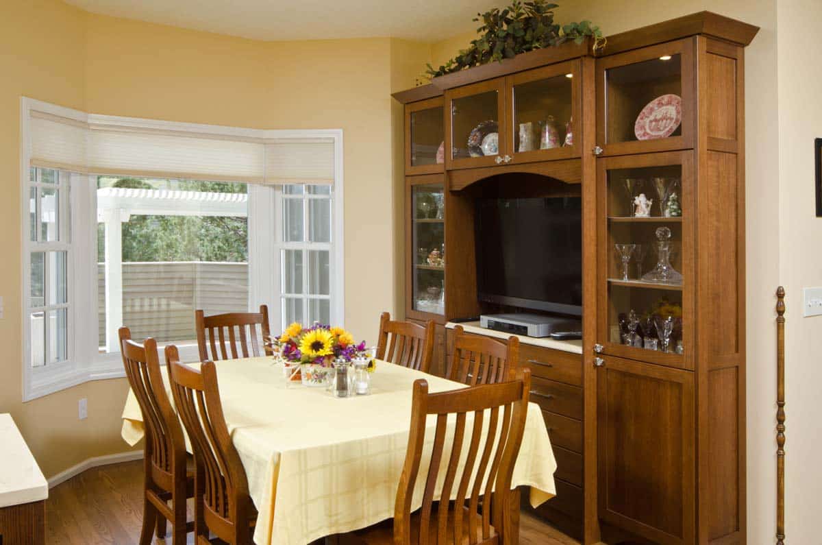 dining area with cabinet chairs and table