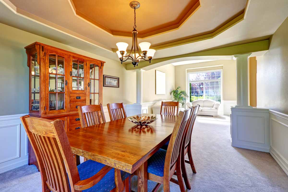 dining room with glass cabinet table and chairs