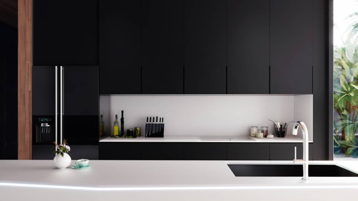 minimalist kitchen with black cabinets white countertop backsplash refrigerator sink and faucet