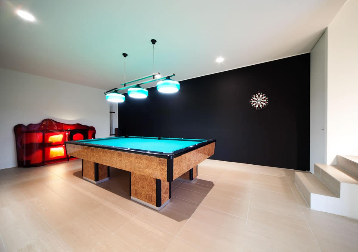 pool room with black accent wall