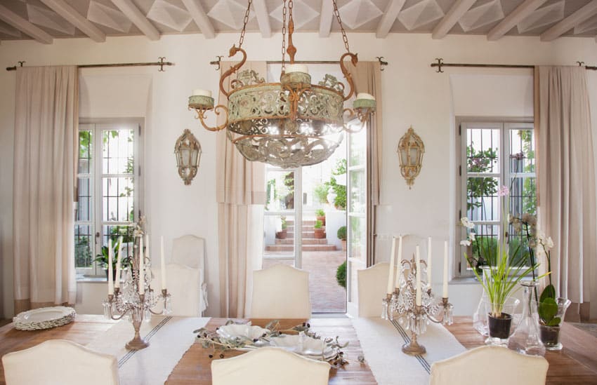 room with chandelier curtains and table