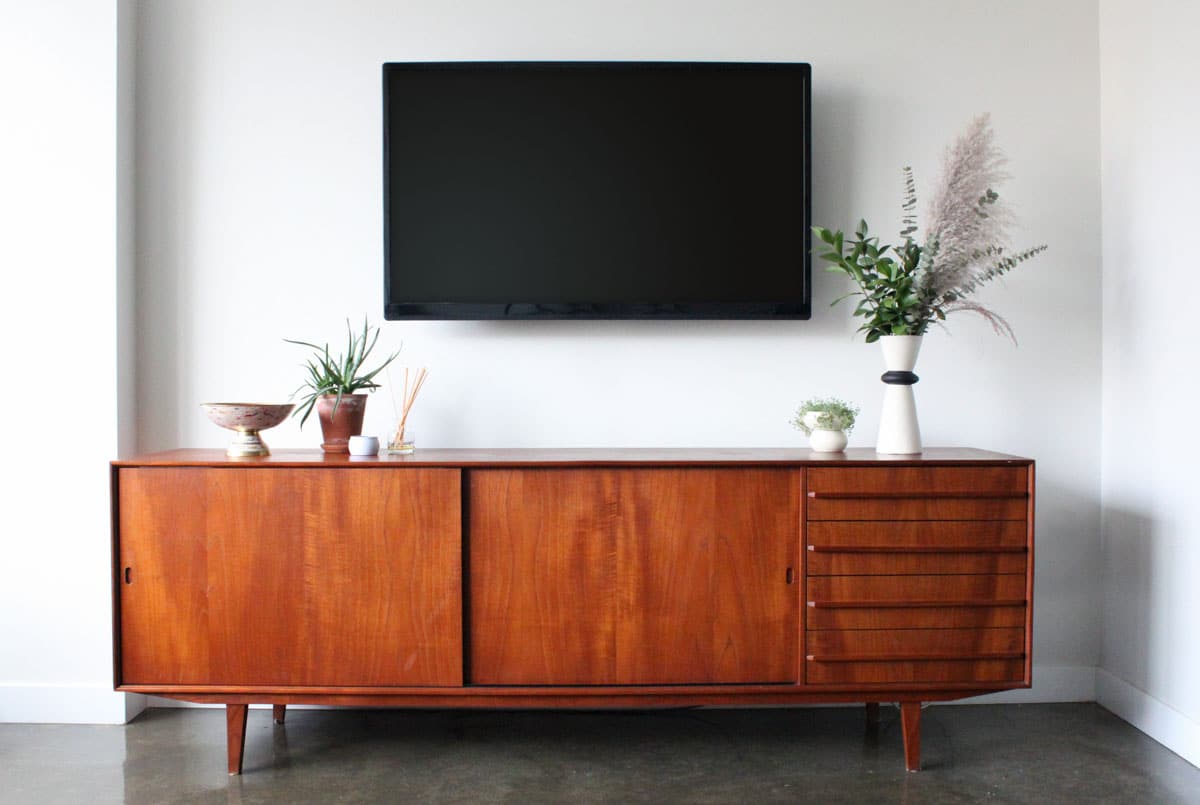 room with dresser and television