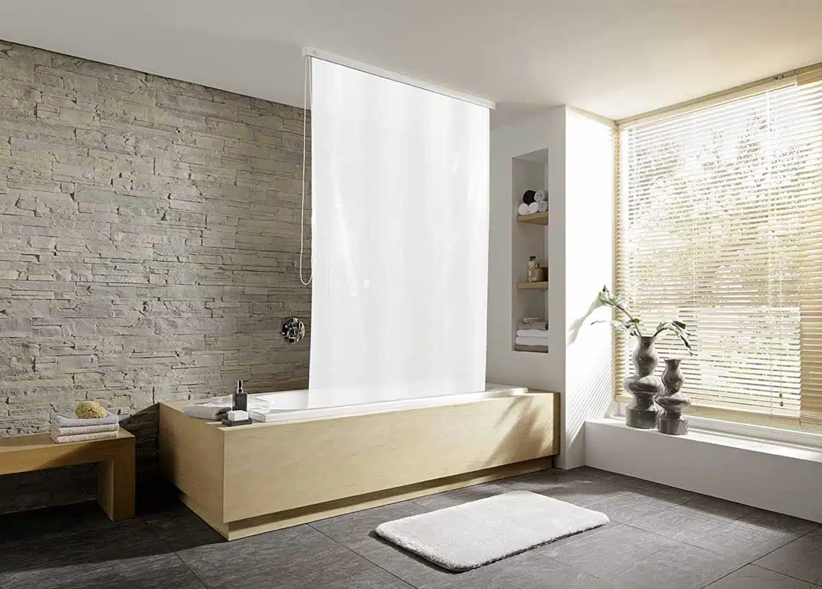 shower with roller shades and tub
