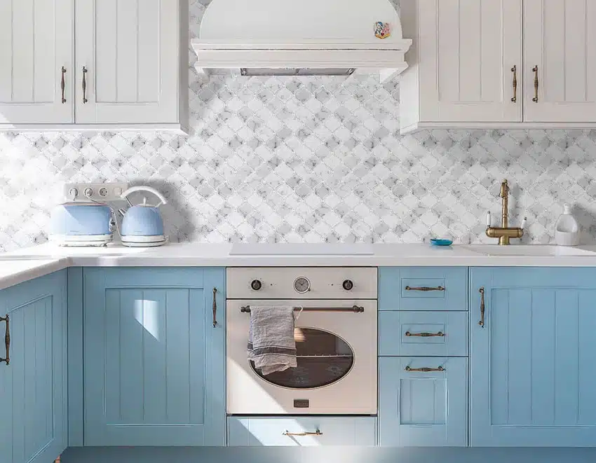 White and blue kitchen with peel and stick backsplash