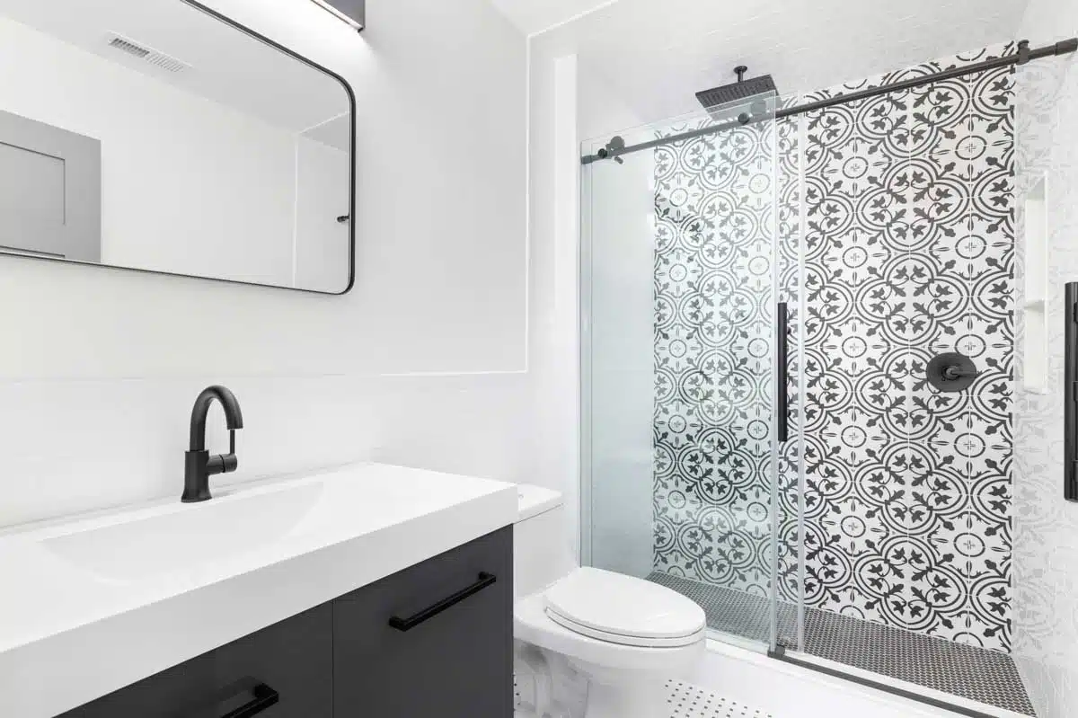 white bathroom with glass sliding doors