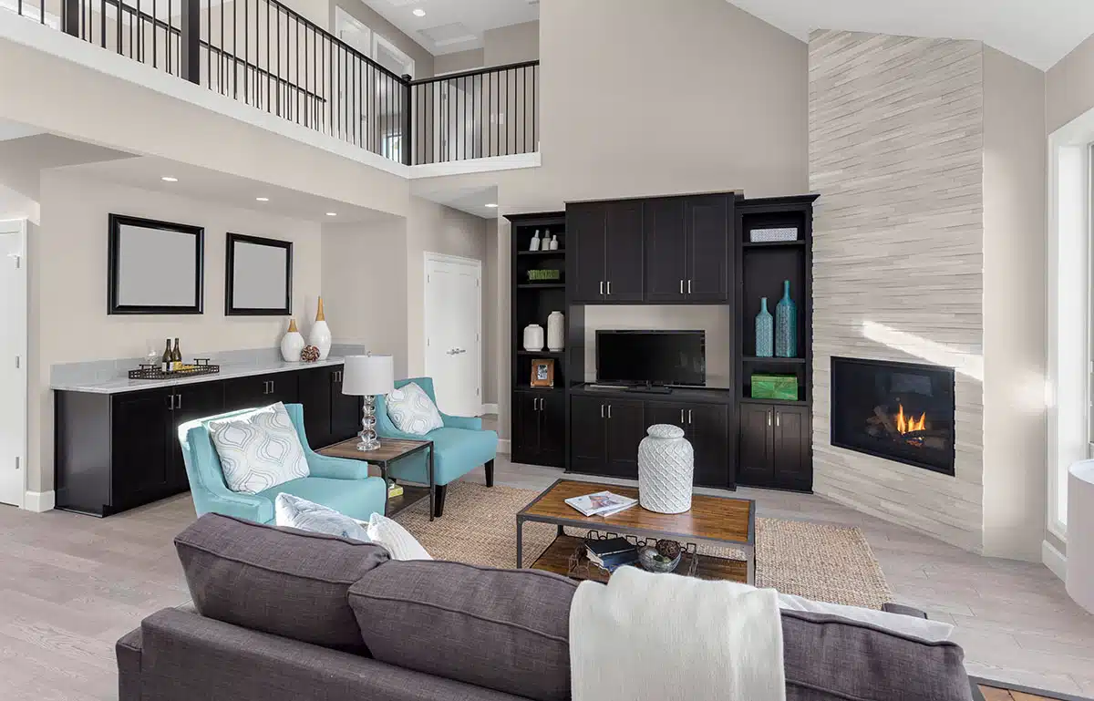 Living area with beige paint and corner fireplace