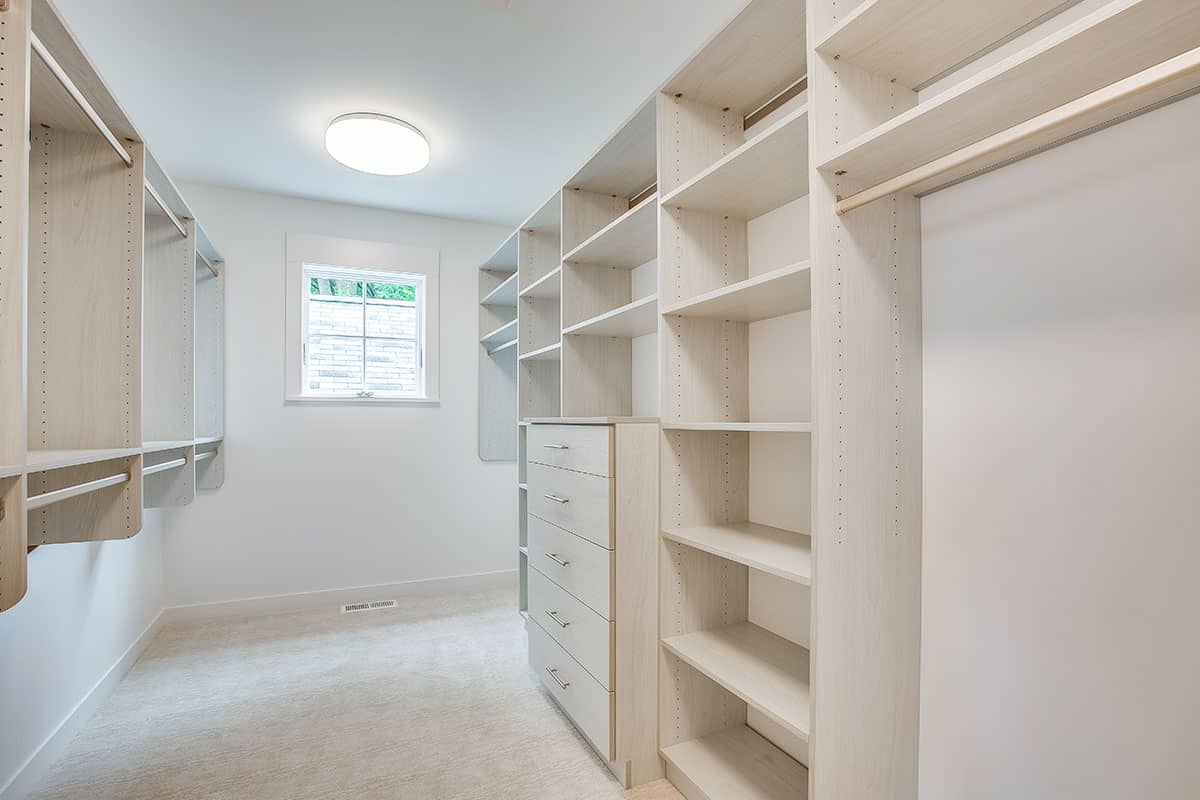 Walk-in wardrobe with carpeted floors