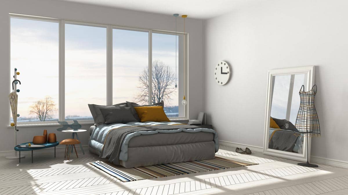bedroom with thermal pane windows and mirror