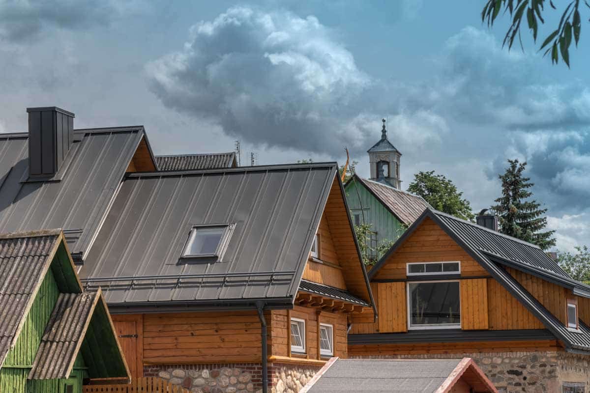 black high pitched roof with skylight and chimney