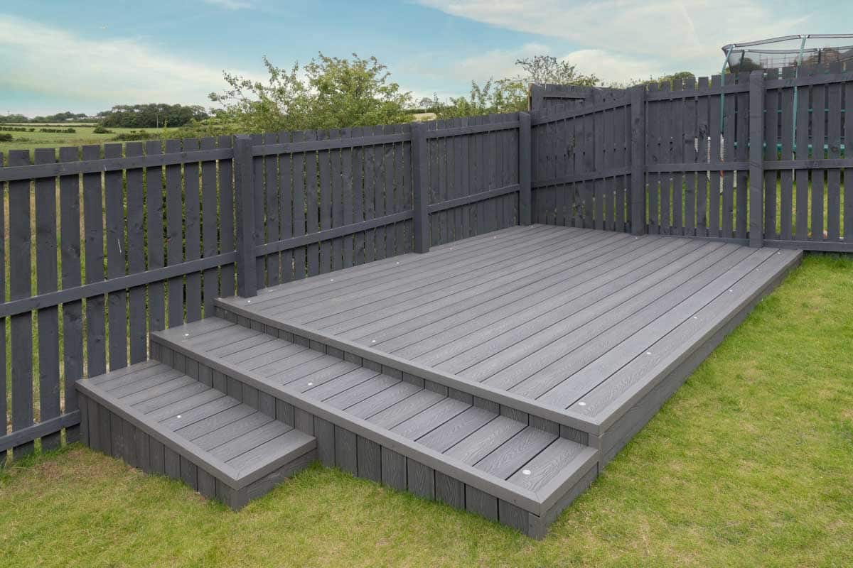 deck installed near gray fences