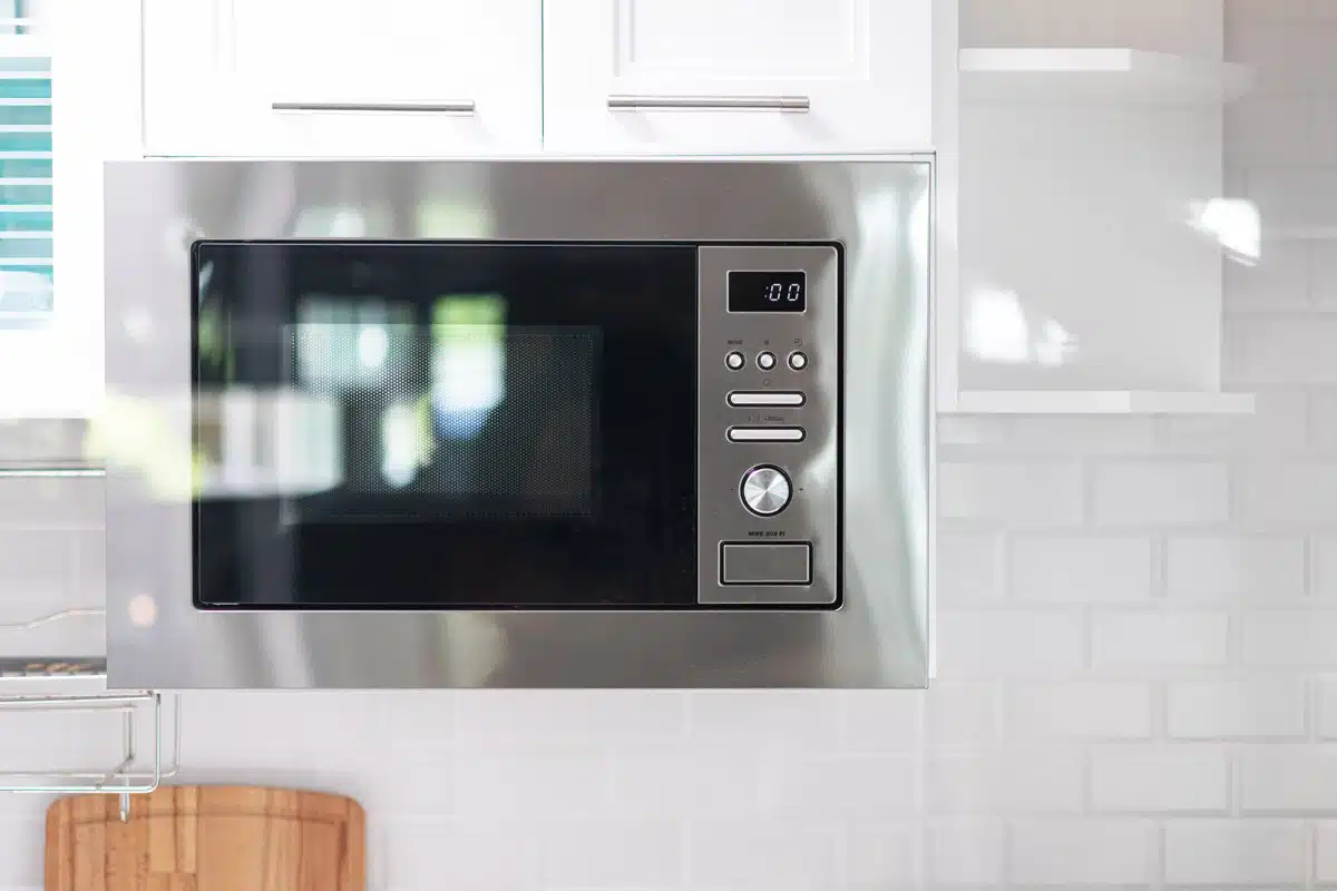 microwave oven on kitchen shelf