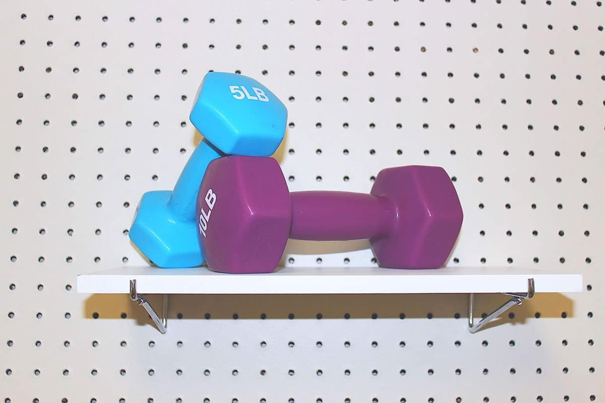 pegboard with gym equipment on it