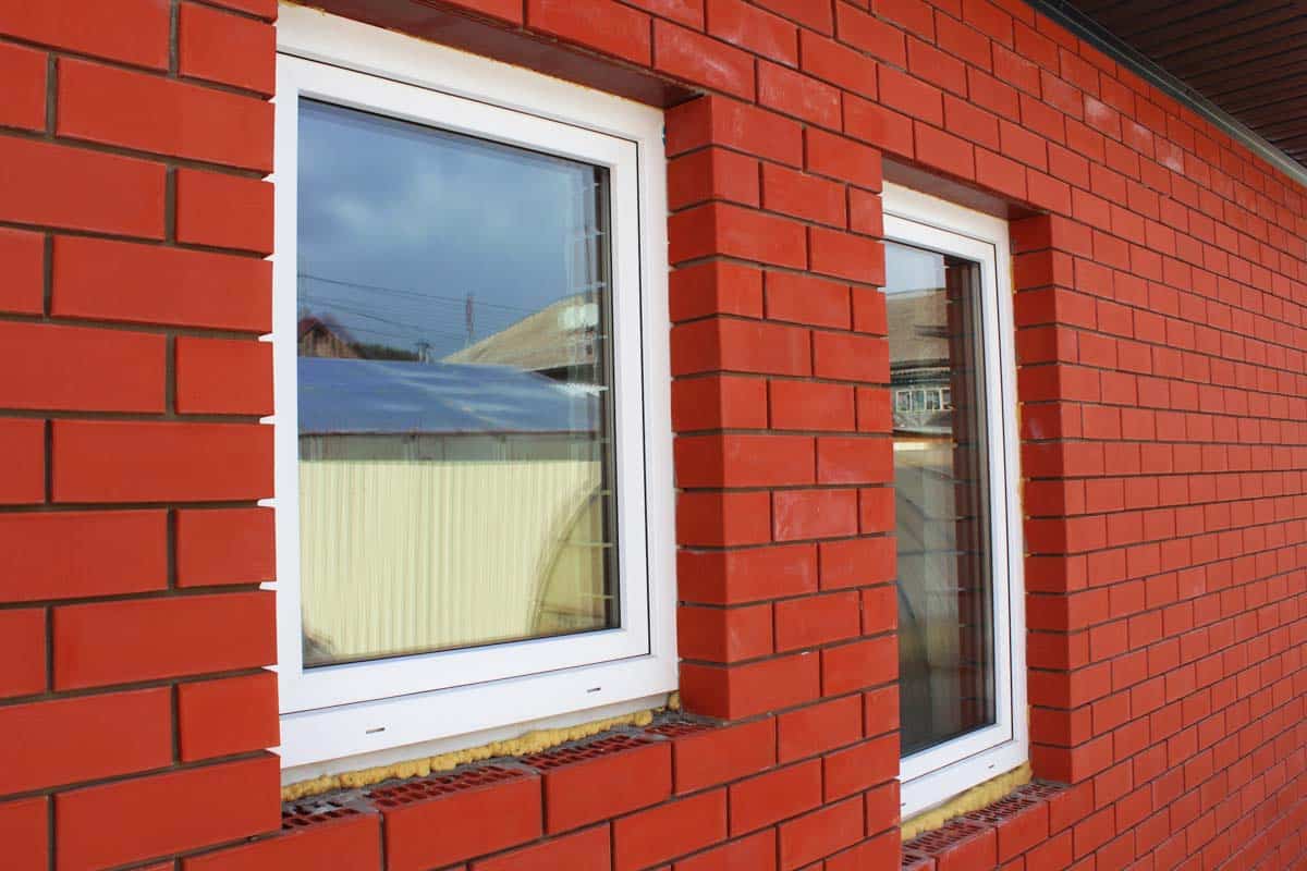 red brick house with fiberglass windows