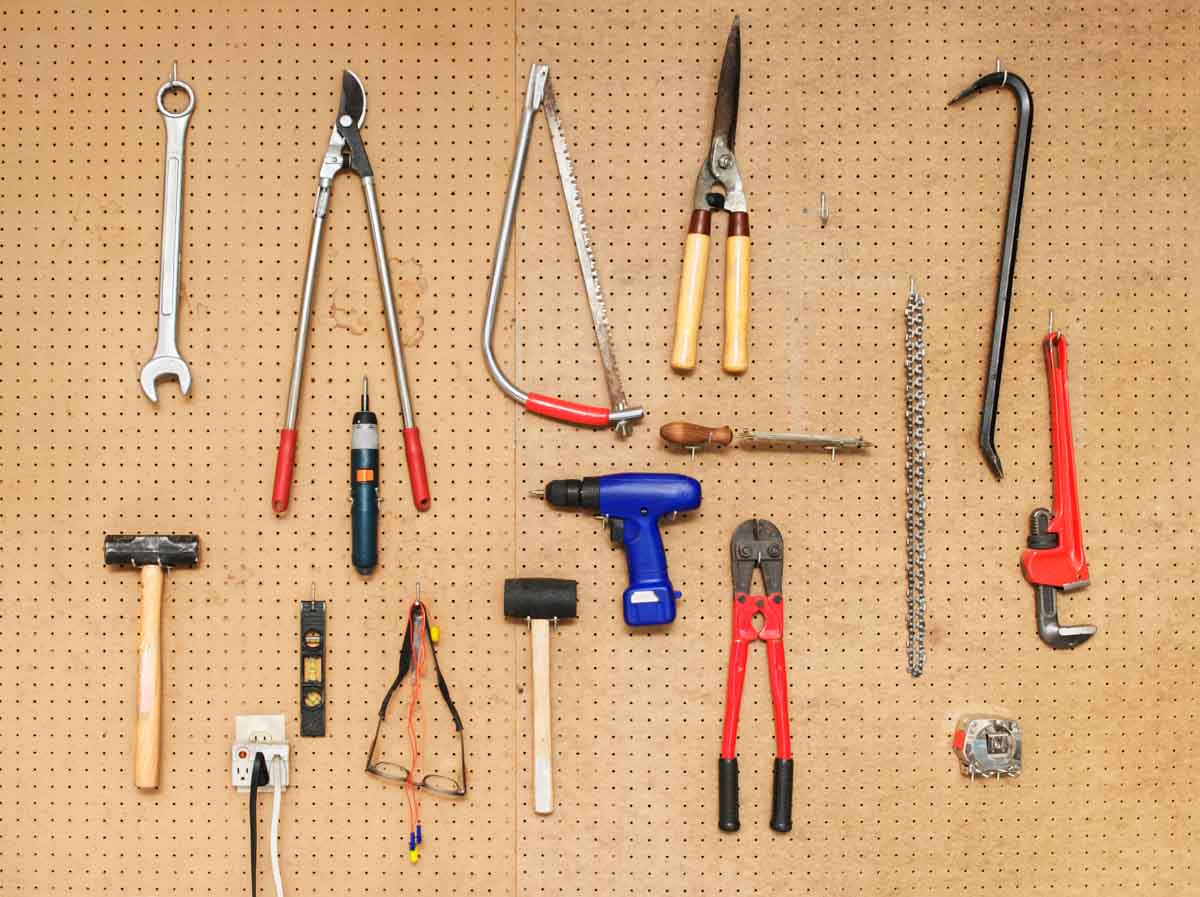tools hanging from pegboard