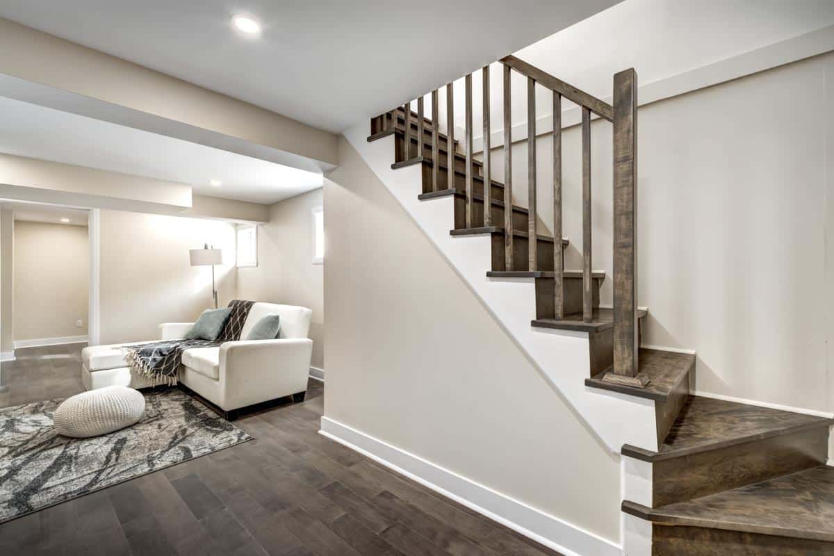 basement with wooden stairs and flooring