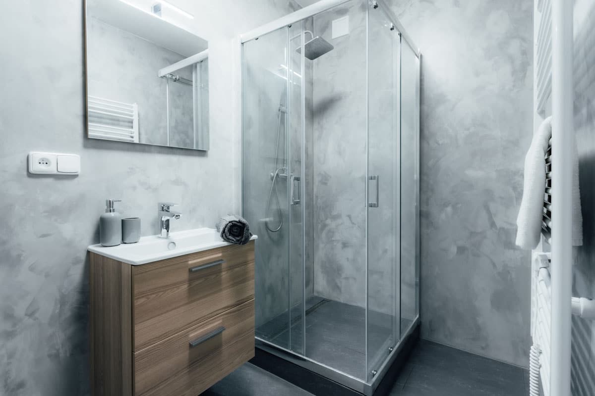bathroom with cement shower walls