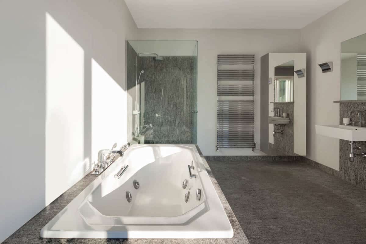bathroom with shower tub and mirror