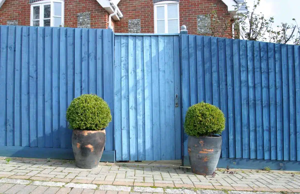 blue fence with gate