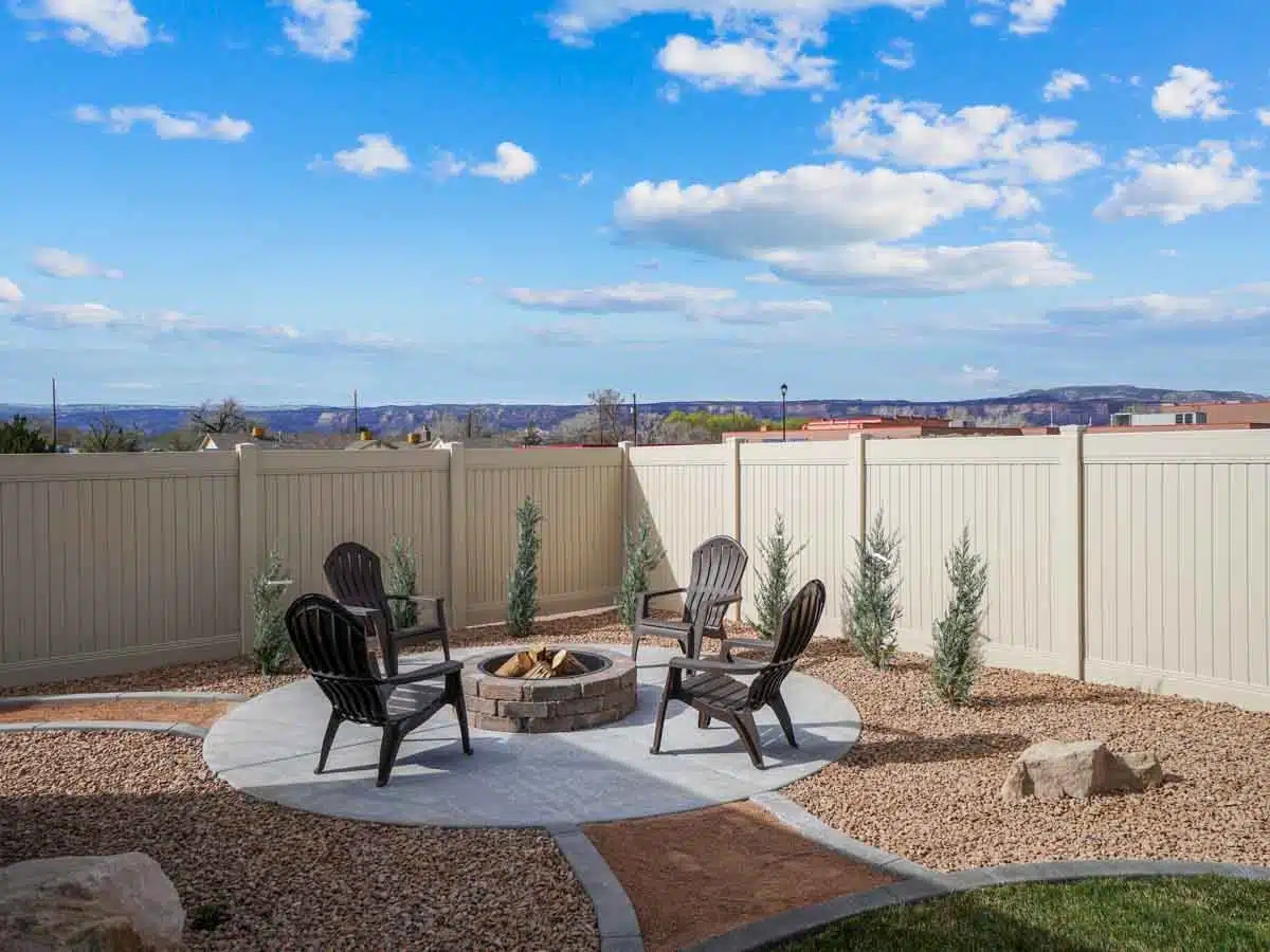 creamy beige fence in backyard with fire pit
