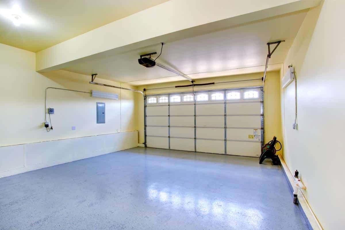 well lit garage with flooring and painted walls