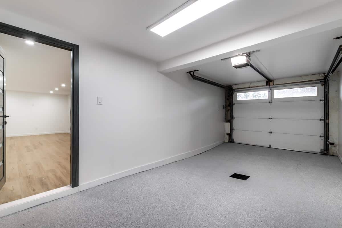 garage space with flooring and door