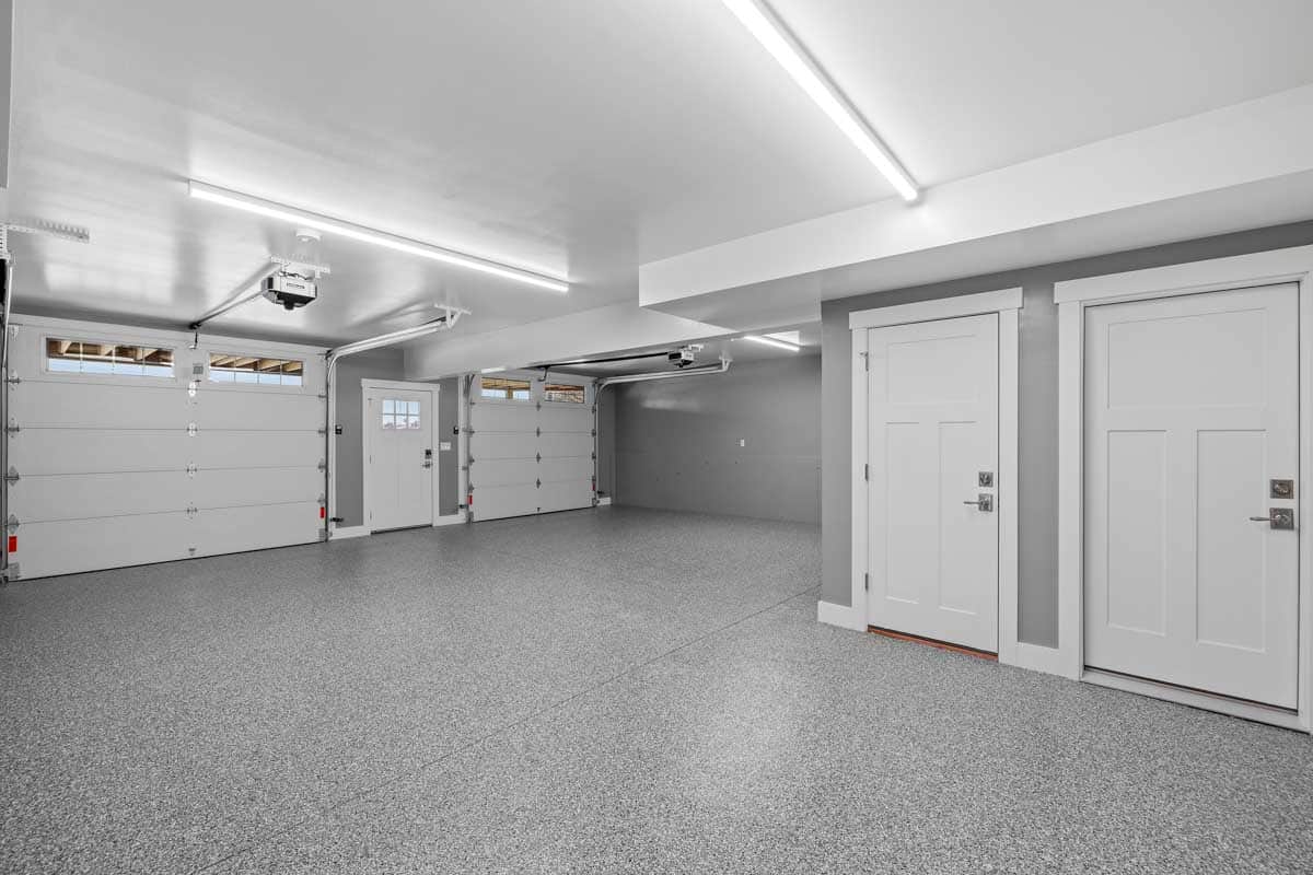 garage with doors and ceiling lights