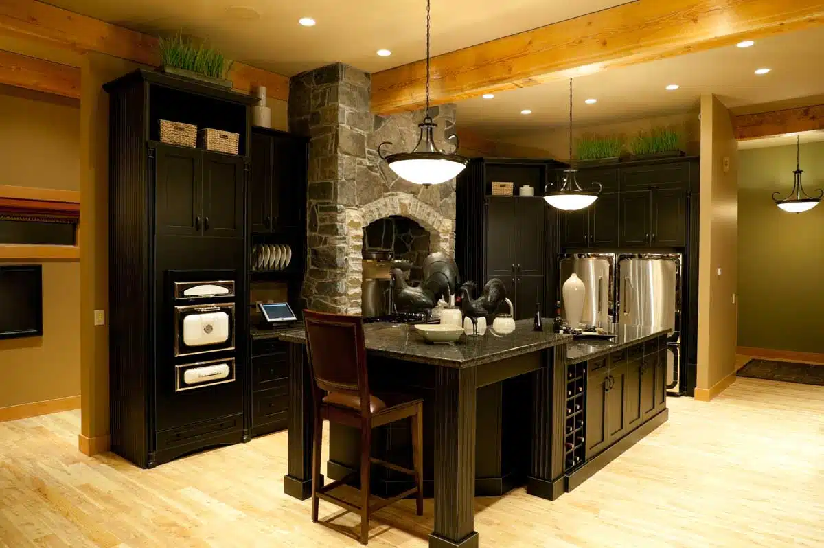 kitchen with dark cabinets island and refrigerator