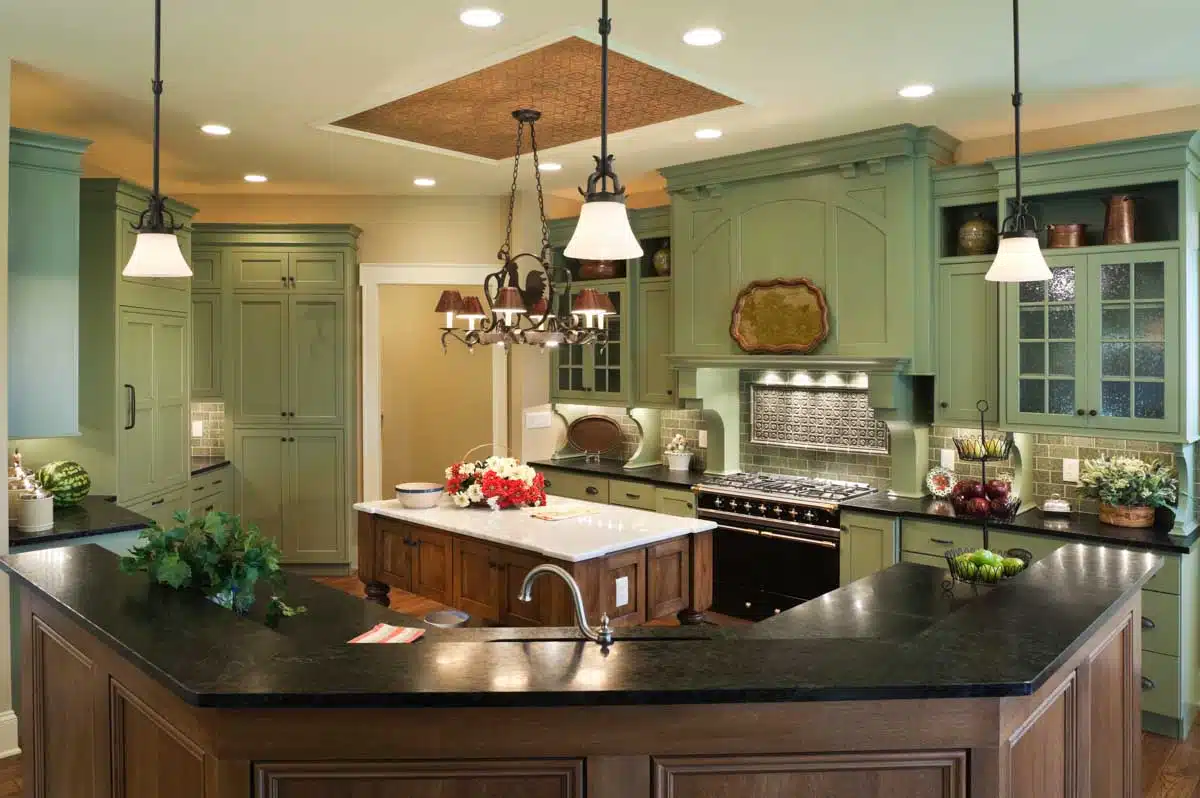 kitchen with island countertop and green cabinets