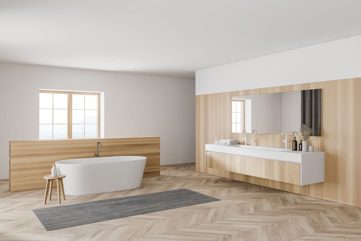 minimalist bathroom with floating vanity and floor rug