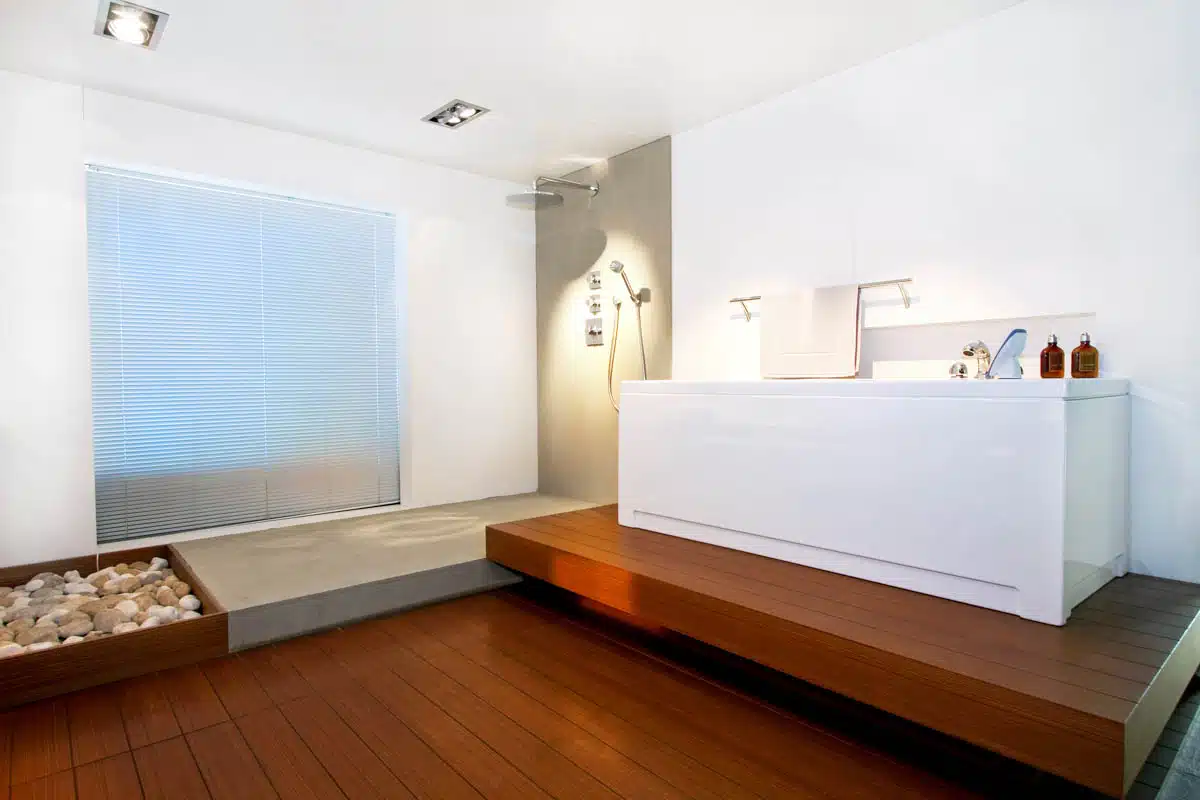 minimalist bathroom with solid surface wall tub and shower