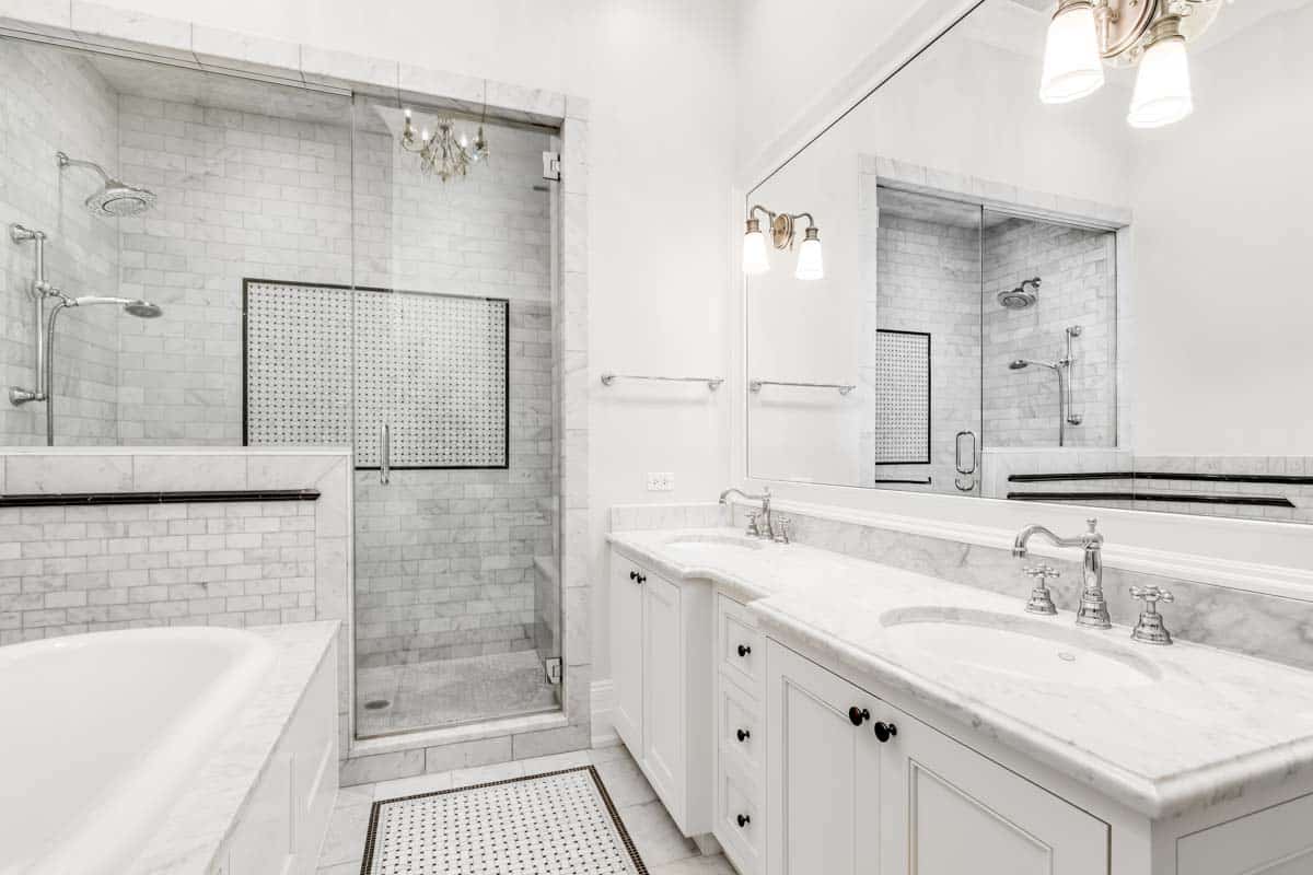 shower with groutless wall tiles and bathroom vanity area