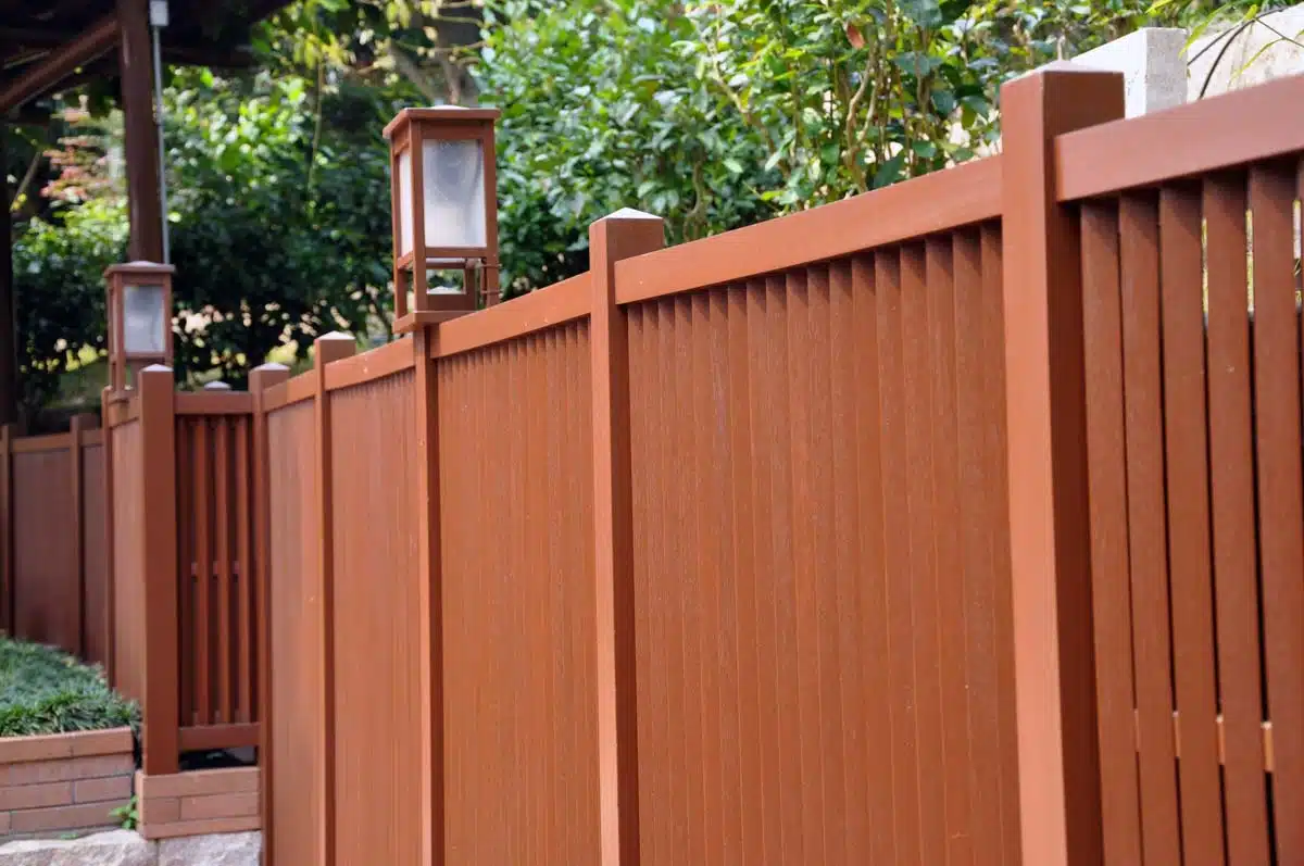 warm brown fence with lighting fixtures