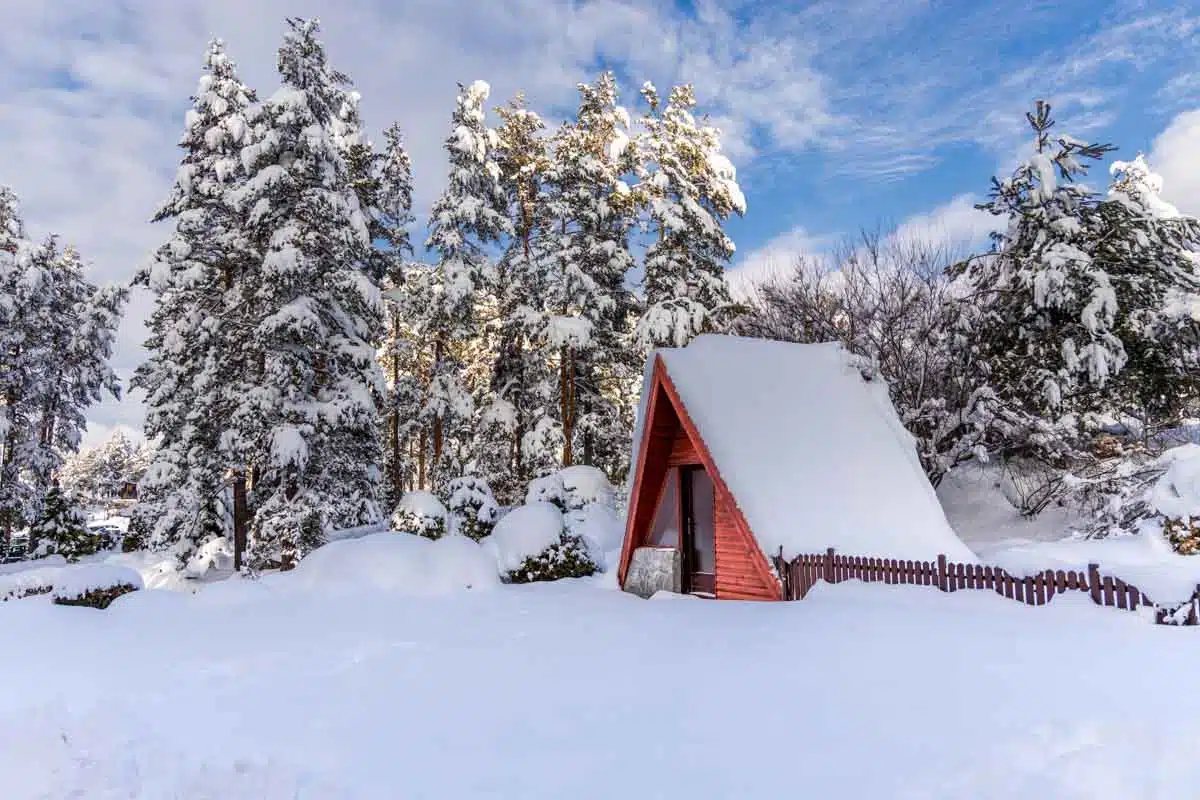 a-frame house in snow filled area