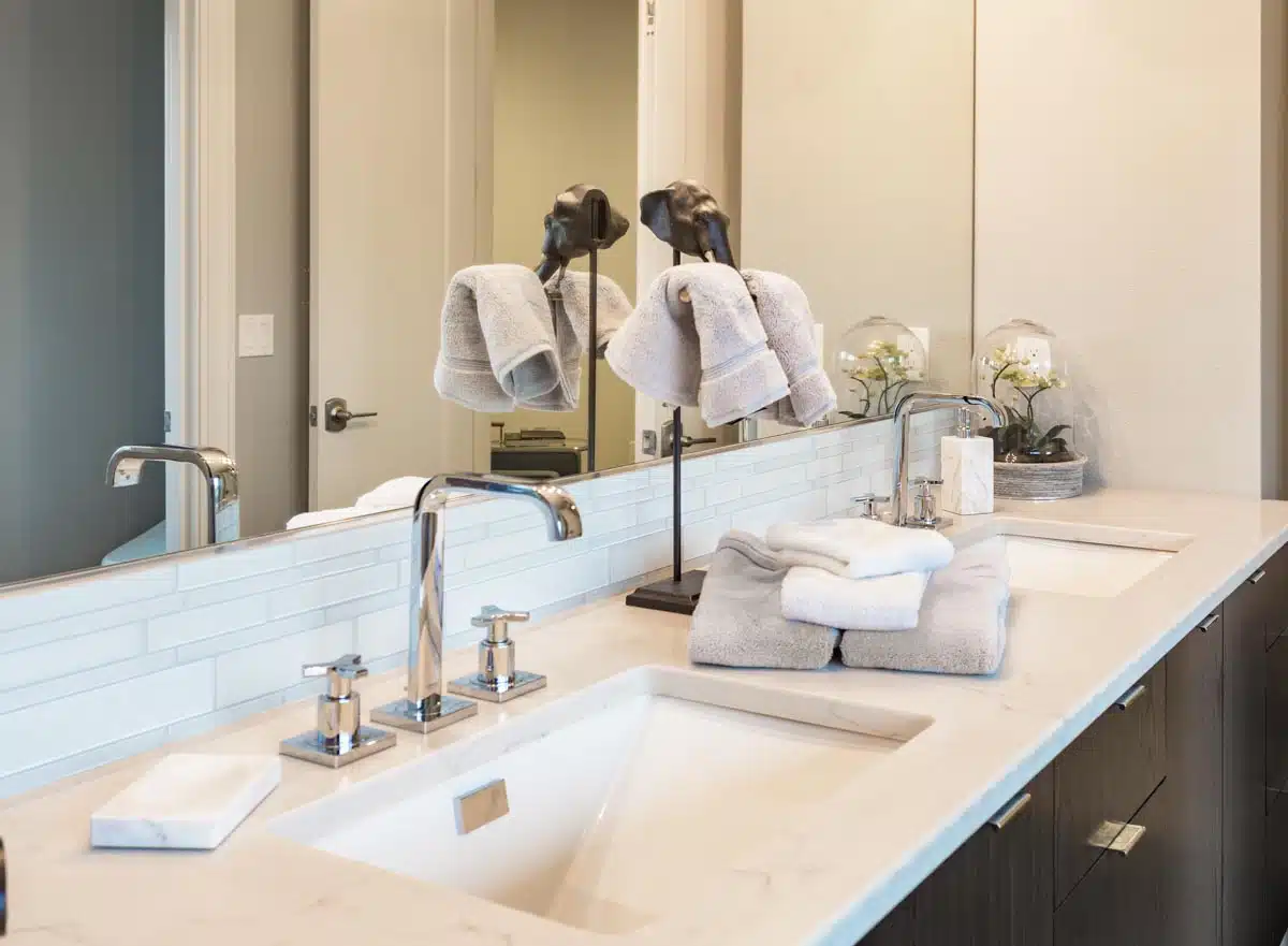 bathroom countertop with sink faucet and mirror