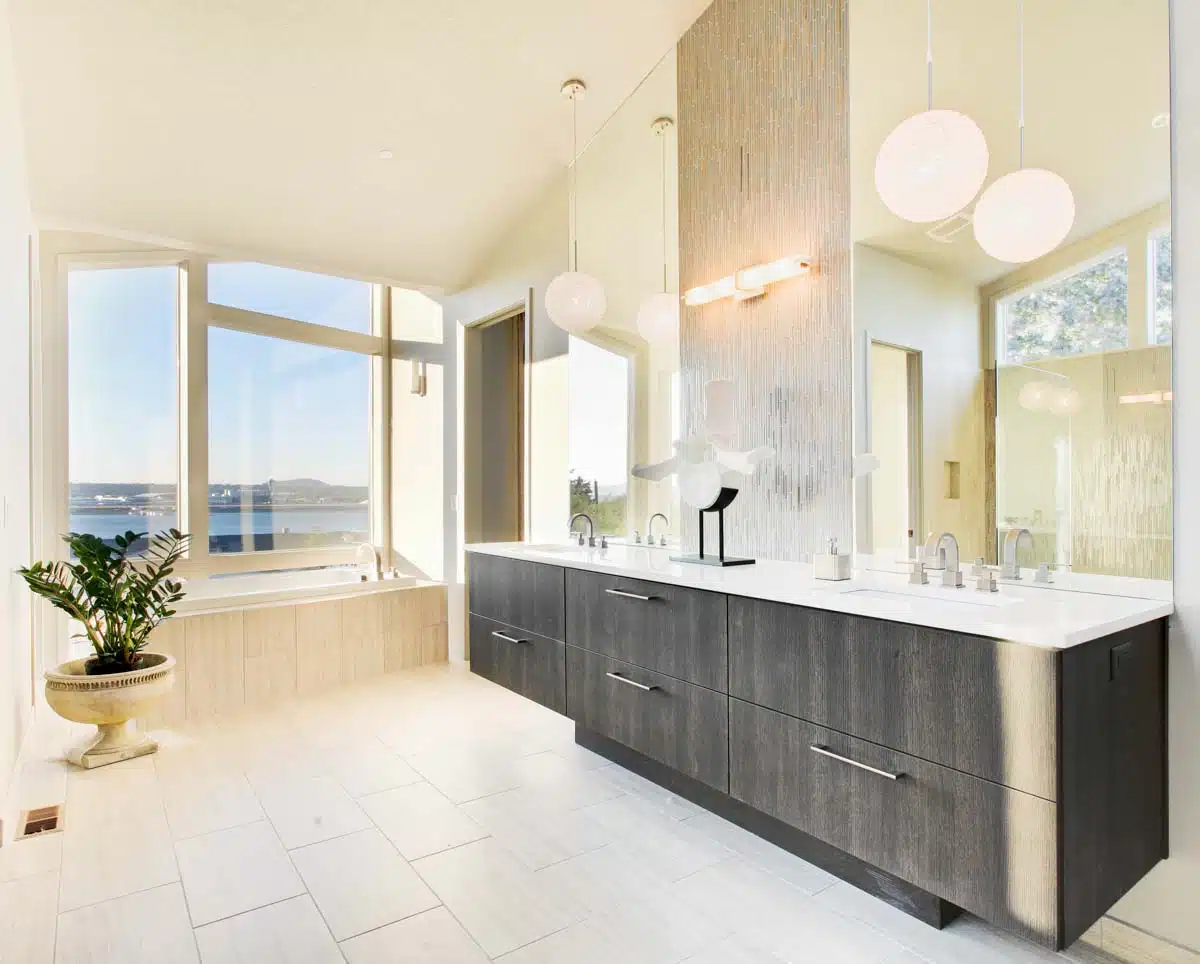 bathroom with tile flooring and tub