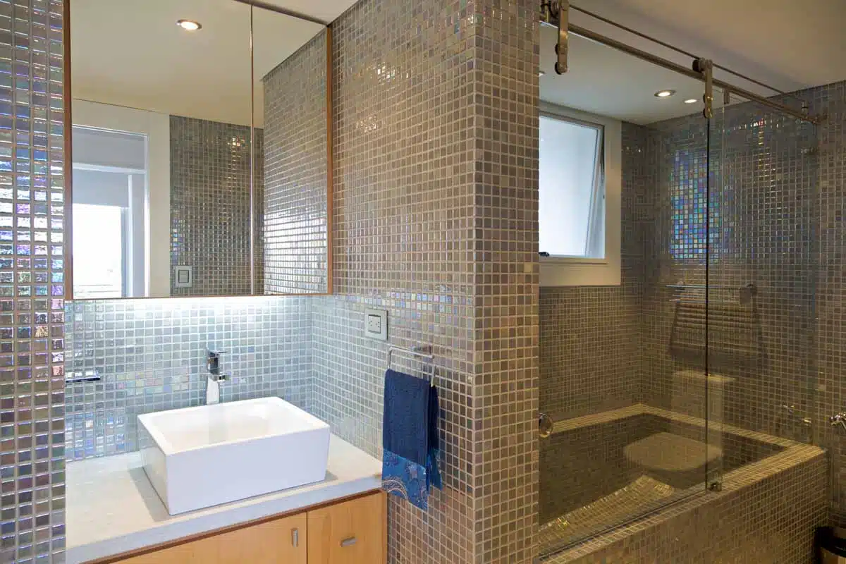 colorful tiled shower bathroom vanity