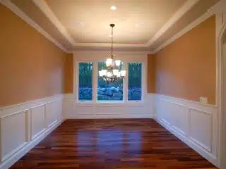 empty room with chair rail molding and wood floor