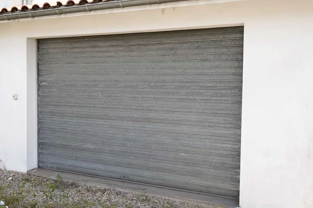garage with corrugated metal door