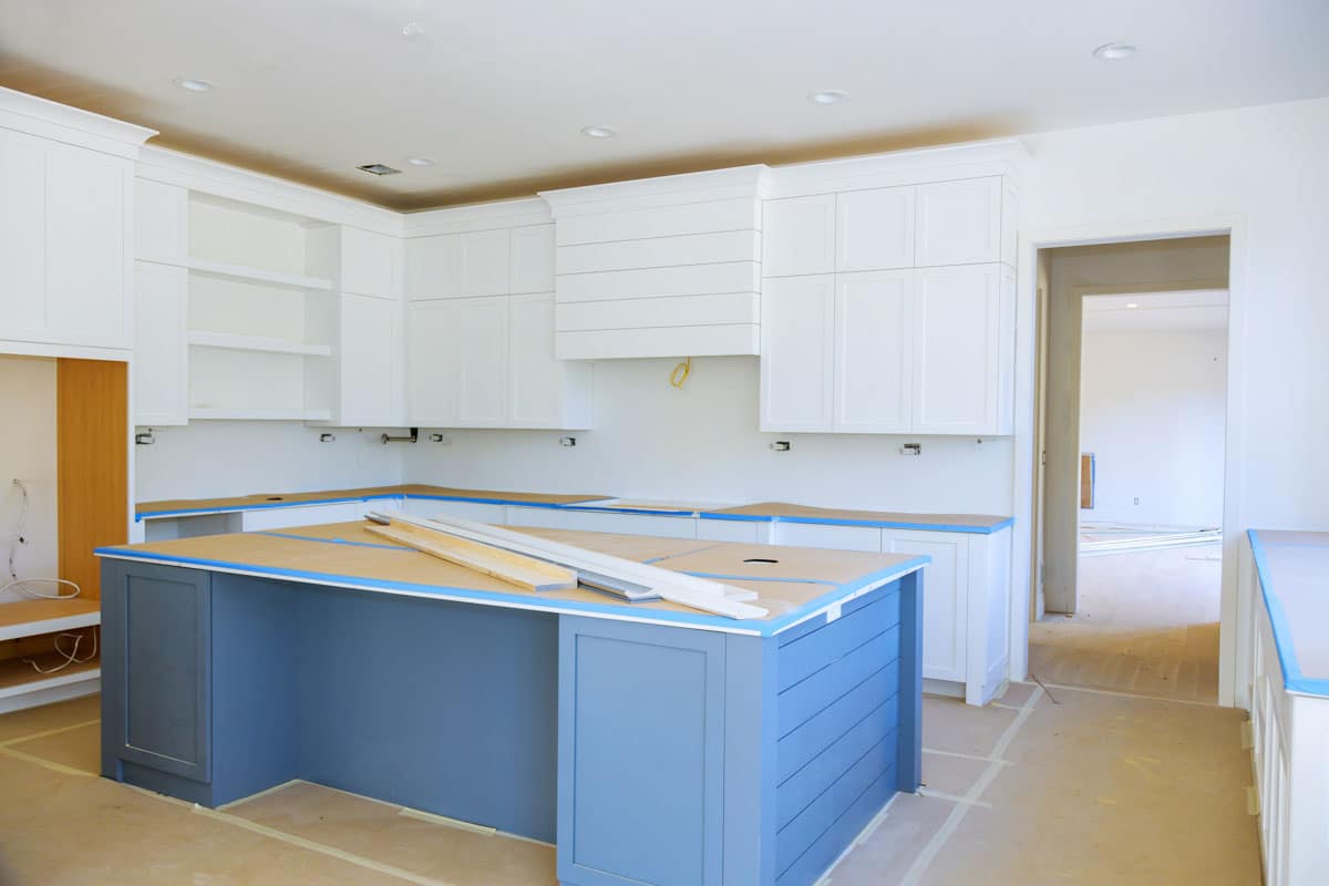 island and cabinets being built in kitchen