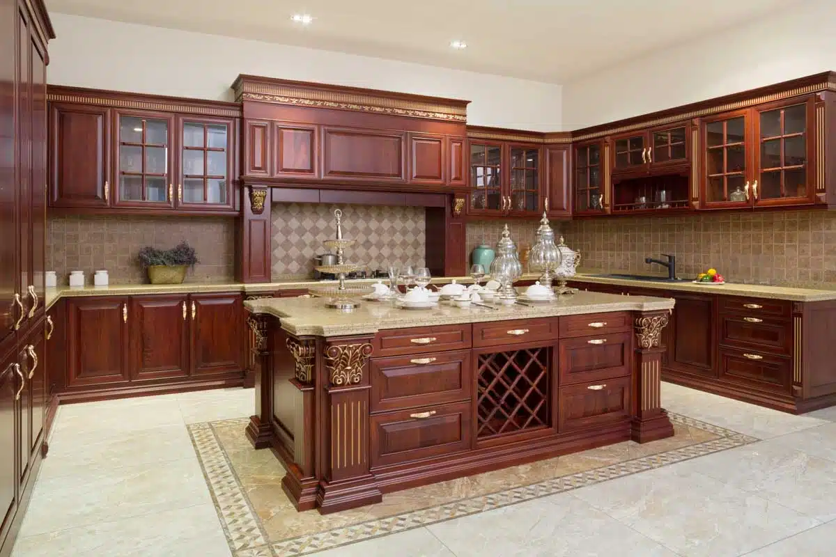 luxury kitchen with beige floor and dark wood cabinets