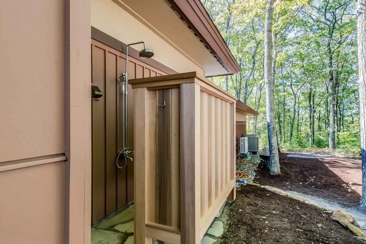 outdoor area with shower and privacy cedar wall