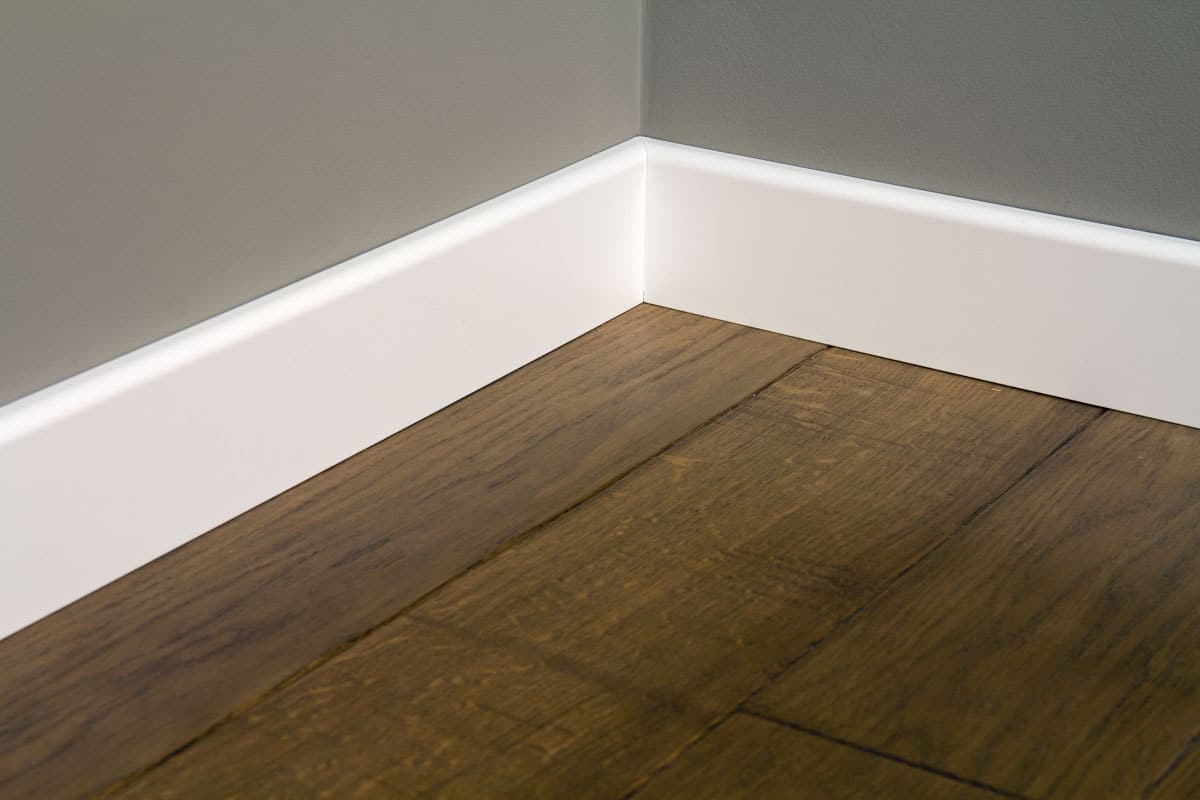 room with baseboard and flooring