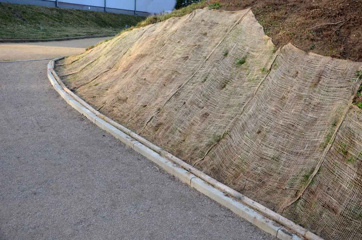 slope with erosion prevention mat