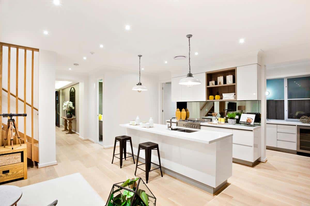 spacious kitchen with island and pendant lights