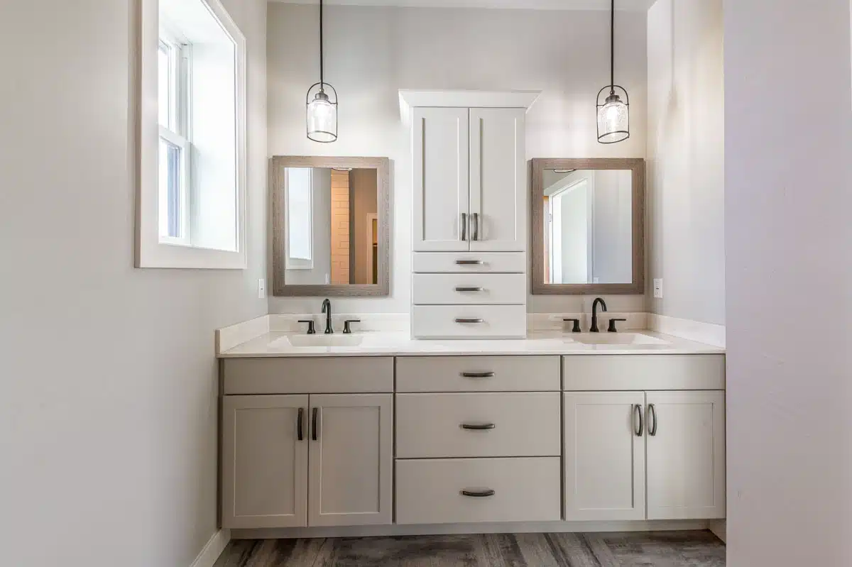 vanity bathroom area with cabinets and drawers