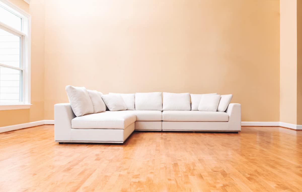 white sectional seating sofa in room