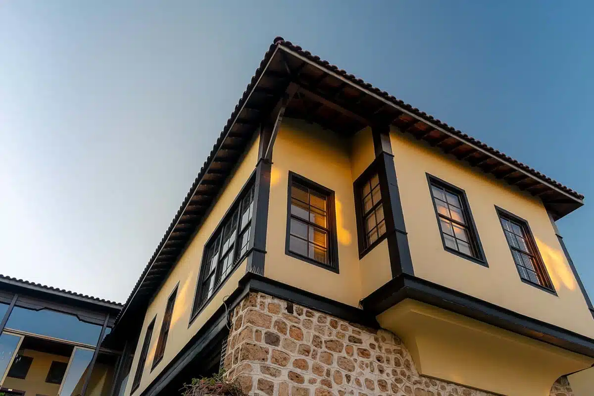 yellow house with black roof