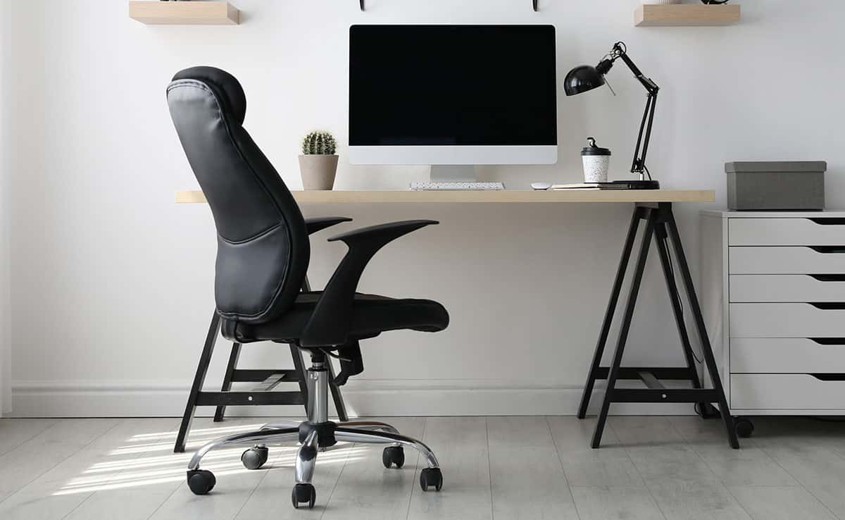 Desk with ergonomic style chair drawers and lamp