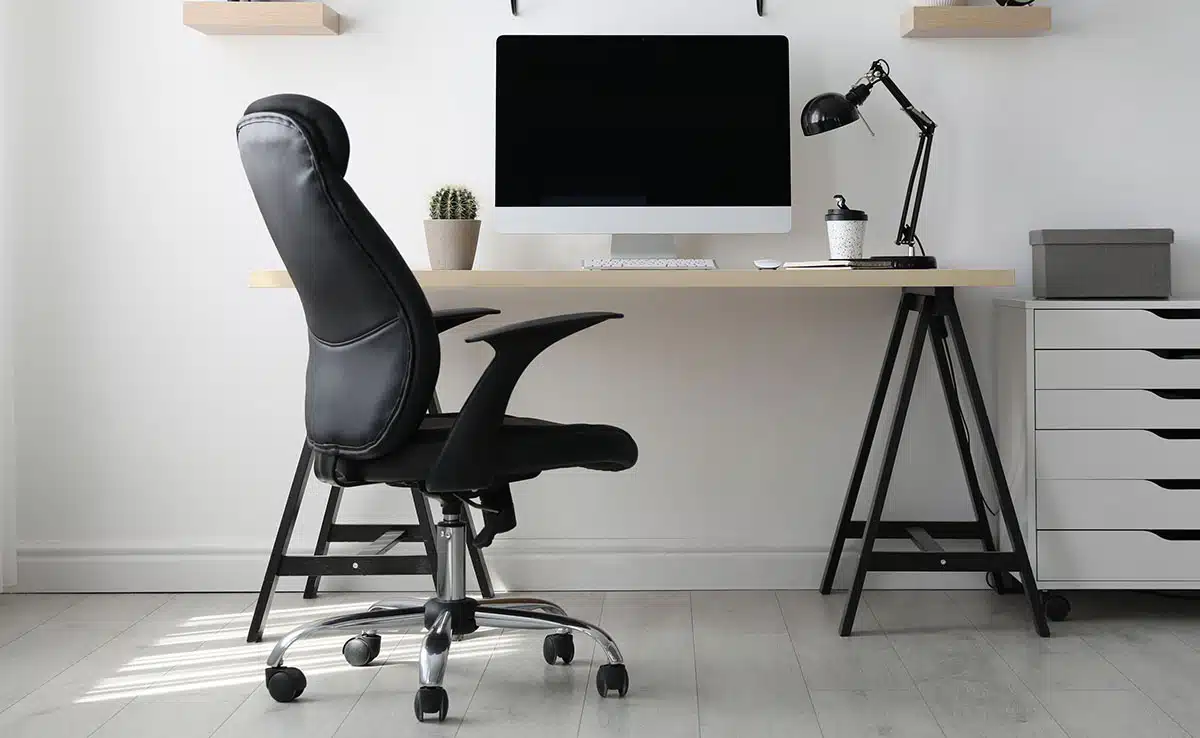 Desk with ergonomic chair, drawers and lamp